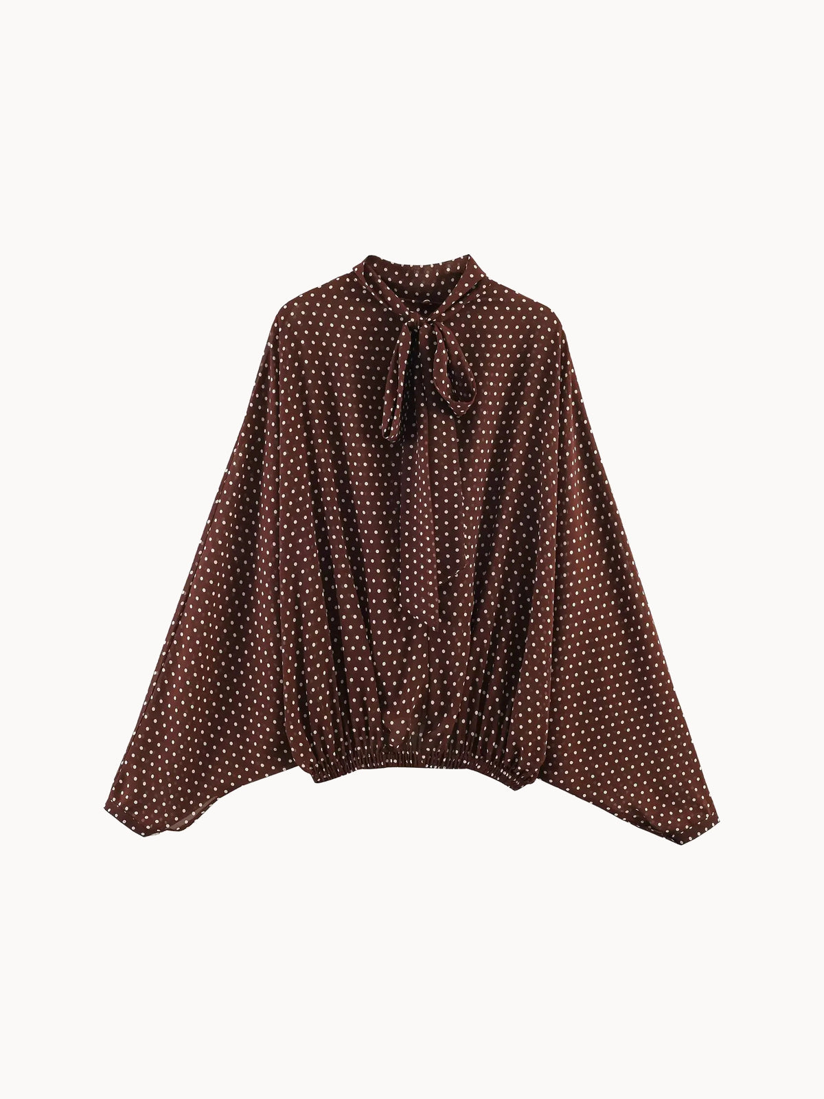 Blusa de gasa marrón de lunares con manga murciélago y lazo